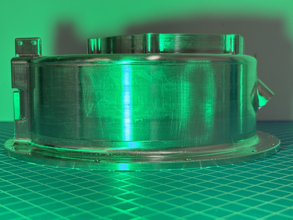 A coated metal component under inspection illumination